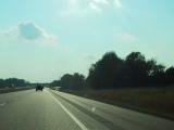 Looking out of the windshield at a freeway.