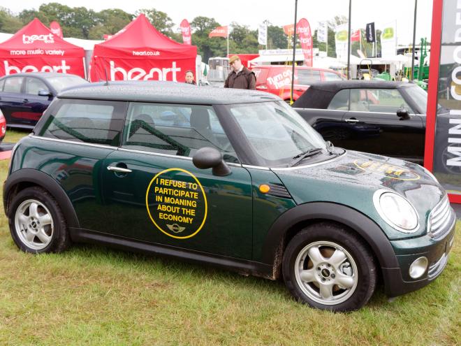 A Mini with 'I refuse to participate in moaning about the economy' written on the side