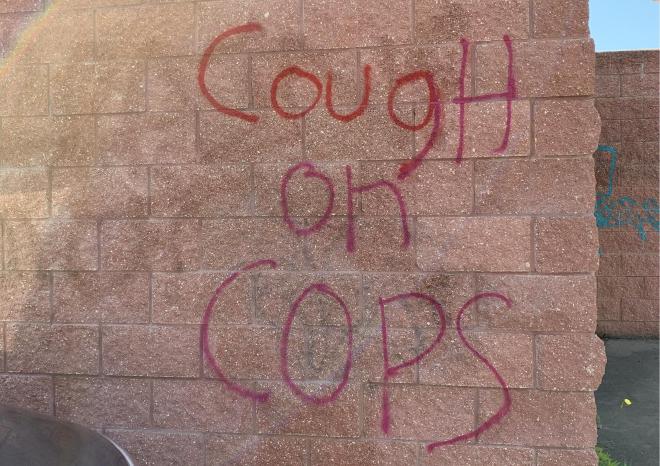 Pandemic graffito: “Cough on cops”