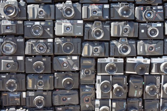 A large number of cheap cameras glued to the side of a van.