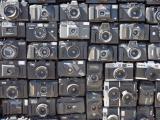 A large number of cheap cameras glued to the side of a van.
